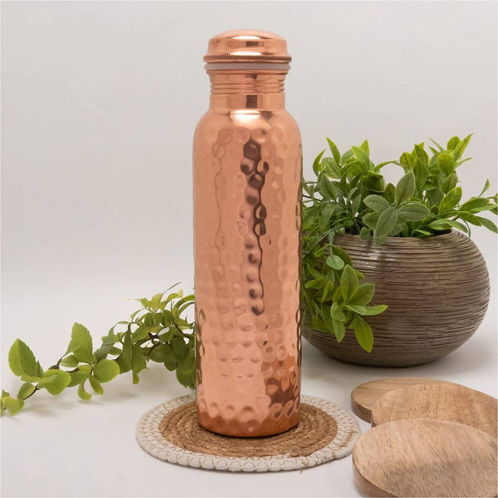 Pure copper water bottle hammered polished ± 750 ml