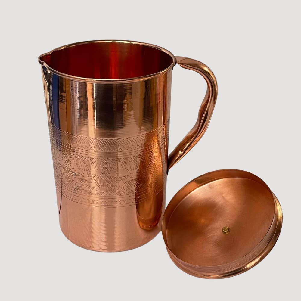 Pure copper jug with flower rim and lid ± 2 litres